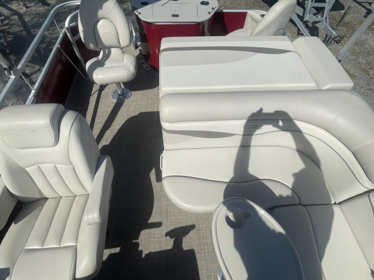 two upholstered rotating chairs at the back of a pontoon boat