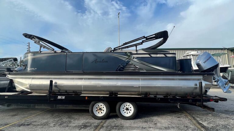 side view of 24’ LSZ 2023 Steel Blue pontoon boat with a double bimini top